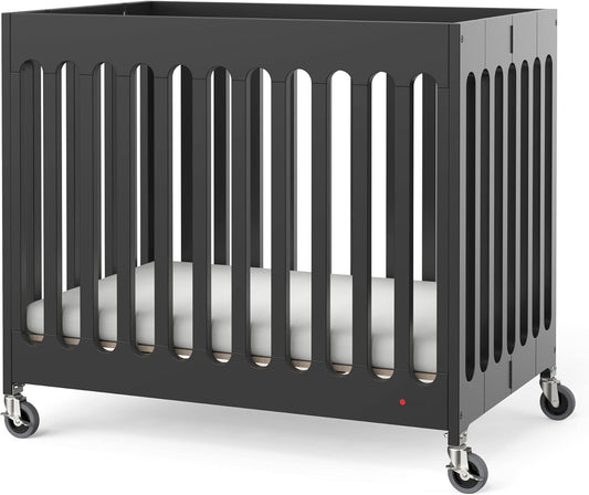 Foundations Boutique Folding Mini Baby Crib - Compact, Portable, Wooden Hotel Crib, Foldable Compact Cribs for Baby & Toddlers - Includes 3" Foam Mattress - Ebony